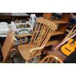 A beech slat back rocking chair