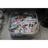 A tub of loose stamps