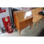 A walnut veneered bureau fitted two drawers