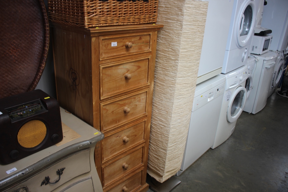 A pine chest of narrow proportions fitted six draw