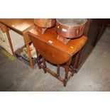 An oak and barley twist drop leaf table