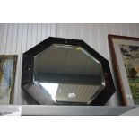 A metal framed bevel edged wall mirror