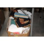 A box of various textiles