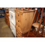 A pair of modern pine bedside chests fitted three