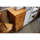 A pair of modern pine bedside chests fitted with t