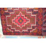 An approx 4'2" x 2'10" Bolochi rug