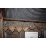 Six hanging wicker planters