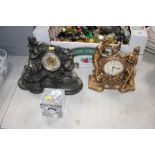 A crystal glass timepiece; and two ornamental mant