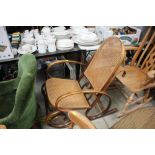 A bent wood and cane seated rocking chair