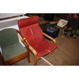 A red leatherette upholstered armchair