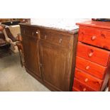 A large oak cupboard fitted two drawers