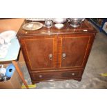 A reproduction mahogany tv cabinet