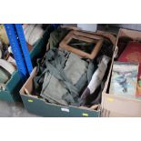 A box containing various military bags and sundry
