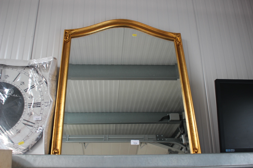 A gilt framed and bevelled edged wall mirror