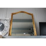 A gilt framed and bevelled edged wall mirror