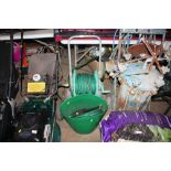 A hose and a reel and a plastic tub and contents