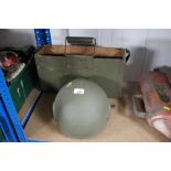 An ammo box and a military helmet