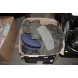 A box of various military clothing, caps, webbing