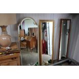 Two bevelled edged wall mirrors