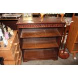 An oak open fronted bookcase