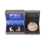 A pair of Thomas Nash cuff-links in the form of na