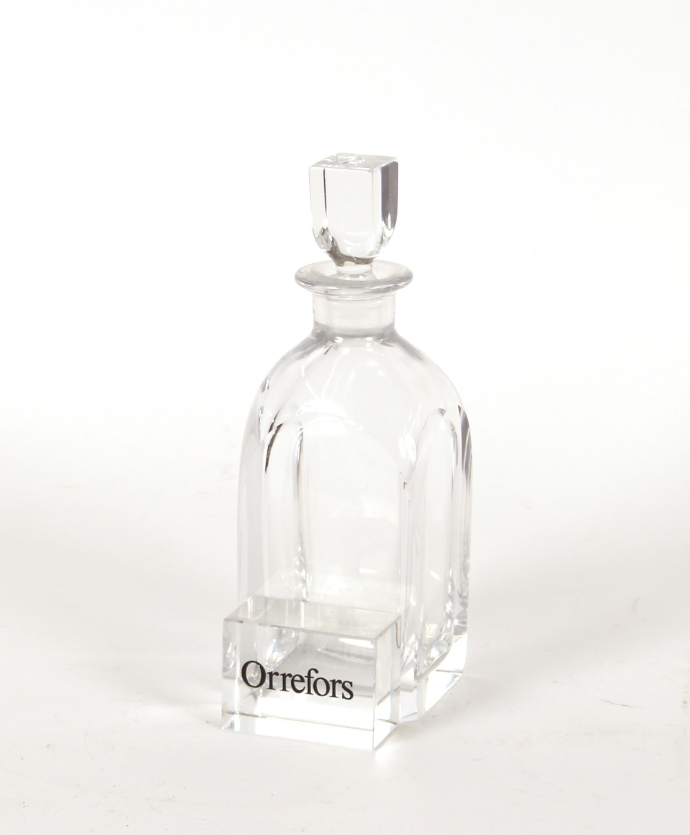 An Orrefors glass decanter and paper-weight