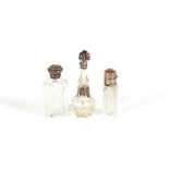 Three glass silver and white metal mounted scent b