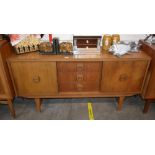 A teak G plan design sideboard, fitted three centr