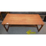 A teak G plan style coffee table, raised on square