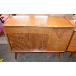 A teak sideboard enclosed by tambour shutter, flan