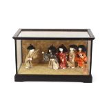A Japanese doll, in glazed cabinet