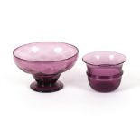 An amethyst glass bowl with ribbed central band an