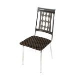 A set of four plastic and steel dining chairs