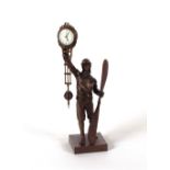 A bronze swing clock, in the form of a pilot