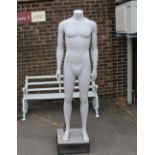 A papier maché mannequin complete with stand