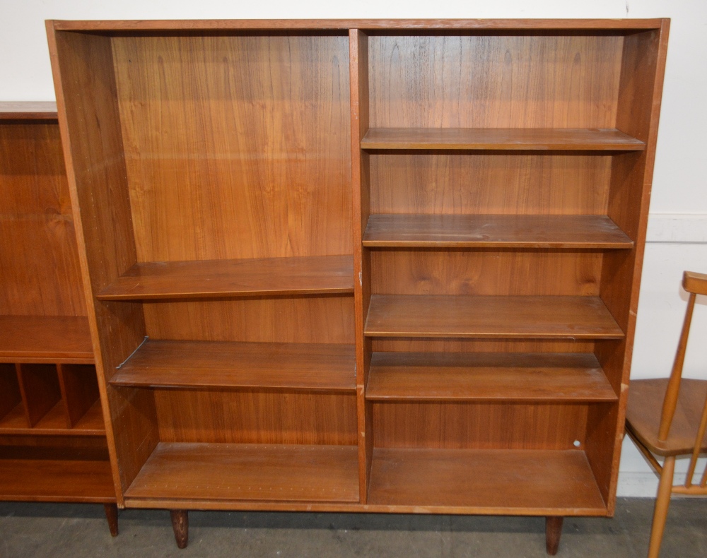 A teak bookcase, fitted open adjustable shelves an