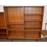 A teak bookcase, fitted open adjustable shelves an