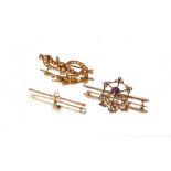 An Edwardian 9 carat gold bow brooch, set with see