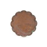 An Arts & Crafts pie crust bordered copper tray, w