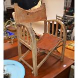 A Torck child's folding bentwood and leather armchair