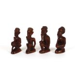 Four vintage carved African native figures