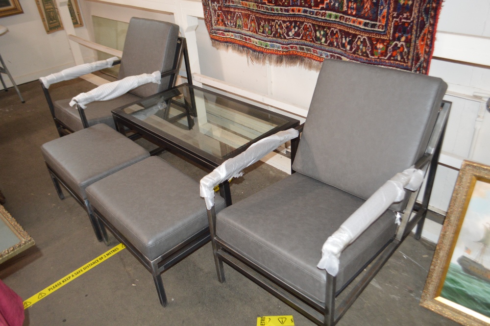 An industrial style metal framed chair and coffee