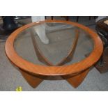 A teak G plan circular coffee table with glass ins