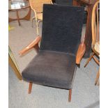 A teak framed deep seated armchair, circa 1970's