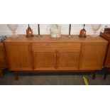 A teak G plan design sideboard, fitted central dra