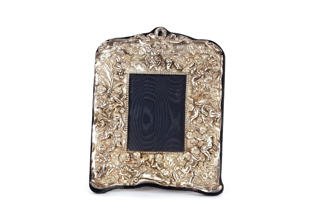 A silver mounted easel photograph frame, profusely