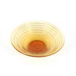 An Art Deco amber tinted ribbed glass shallow bowl, 29cm