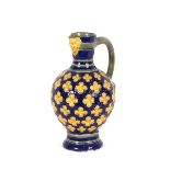 A Minton majolica baluster water jug, the spout wi