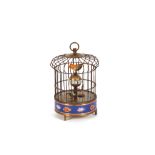 A cloisonne decorated bird cage clock