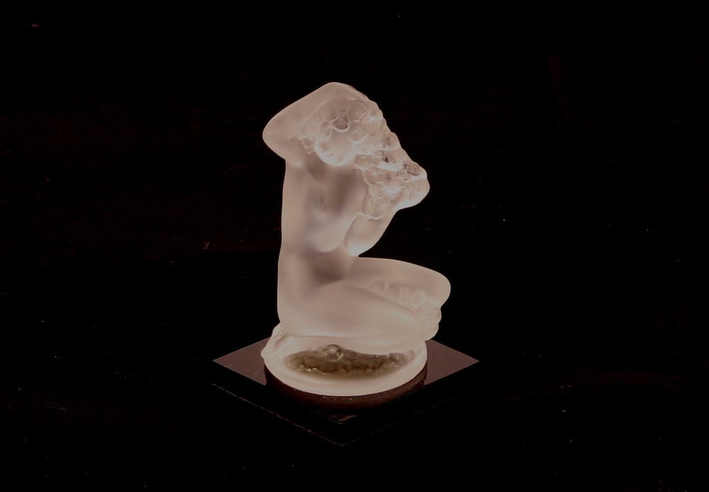 A Lalique glass figure depicting a naked girl with